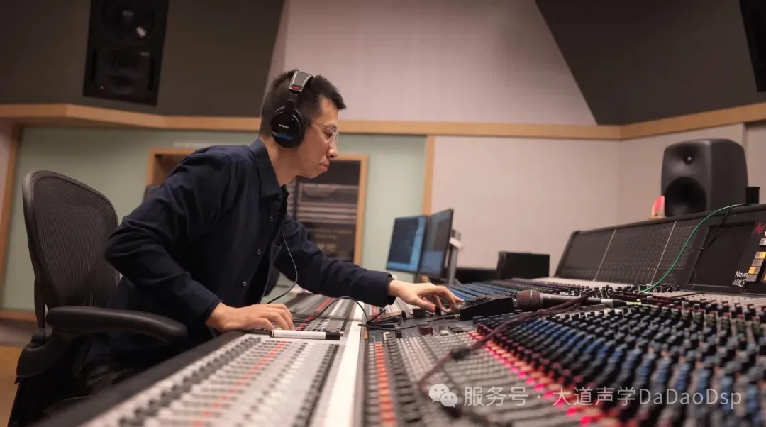 Zhang Yilong working at the studio’s mixing console.